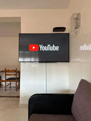 a sign for a youtube sign on a wall at Luxury 2 bedroom apartment - Gueliz Plaza in Marrakech