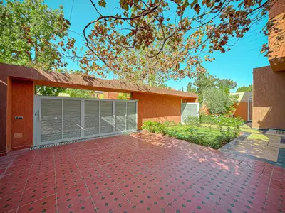 a house with a garage with a brick driveway at Villa Andalus - Piscine privée & Suite Parentale in Marrakech