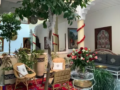 a living room filled with lots of plants at Riad Marhaba Kasbah in Marrakech