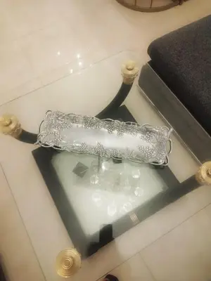 a glass bottle sitting on top of a table at Cocon chaleureux proche commerces et centre in Marrakech