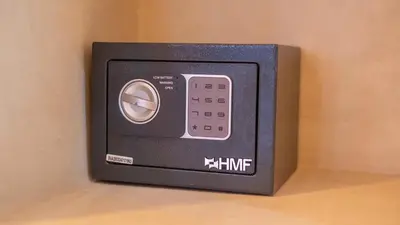 a small black microwave on a wall at Riad Le Soleil Rouge in Marrakech
