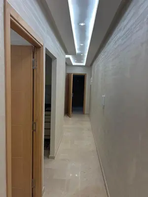 an empty hallway with a ceiling with a hallway sidx sidx sidx at Des appartements conçus pour votre confort in Marrakech