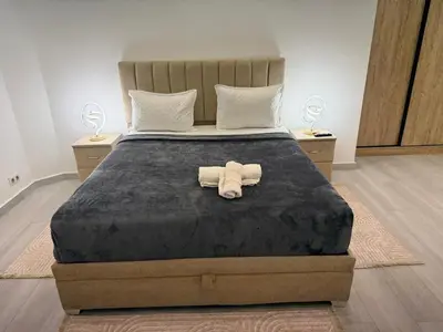 a bed with a towel sitting on top of it at Residence miraj 24 in Marrakech
