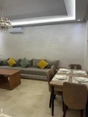 a living room with a couch and a table at Residence miraj 24 in Marrakech