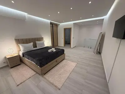 a bedroom with a bed and a television in it at Residence miraj in Marrakech