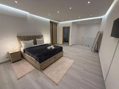 a bedroom with a large bed in a room at Residence miraj in Marrakech