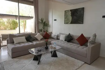 a living room with a couch and a table at Mamounia loft by M&I in Marrakech