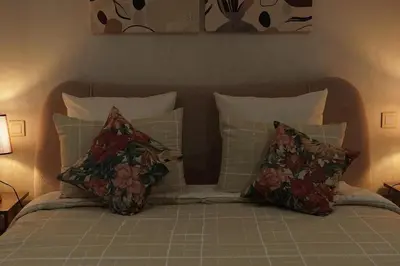 a bed with two pillows and a head board at Mamounia loft by M&I in Marrakech