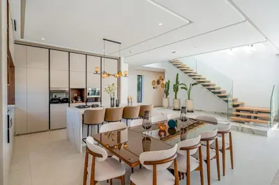 a kitchen and dining room with a table and chairs at Villa Lilas-Luxe Pool, Steam Room & Gym in Segraga