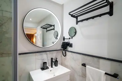 a bathroom with a sink and a mirror at Gueliz Prime 2BR Perfect Central Stay in Marrakech in Marrakech