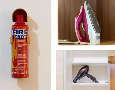 a red bottle of firestop on a shelf with a pen and scissors at Cozy Gueliz Apartment , Access to Pool , Central Location in Marrakech