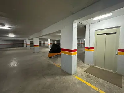 an empty parking garage with a door in it at Cozy Gueliz Apartment , Access to Pool , Central Location in Marrakech