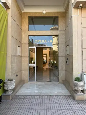 a entrance to an office building with a glass door at Appartement Chic & Cosy Hivernage in Marrakech