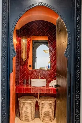 a bathroom with a sink and a mirror at Modern 1BR , Cinema & Xbox , Central Guéliz in Marrakech