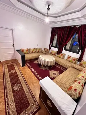 a living room with a couch and a table at Tumsilt in Marrakech
