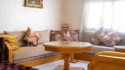 a living room with a couch and a coffee table at Best Location in Marrakech! Modern Chic Apartment in Marrakech