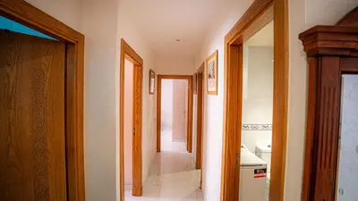 a hallway of a bathroom with a sink and a toilet at Best Location in Marrakech! Modern Chic Apartment in Marrakech