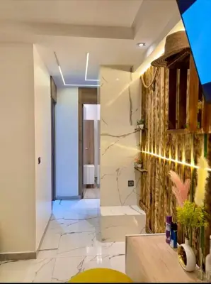 a bathroom with a walk in shower and a sink at Madame plaza in Marrakech