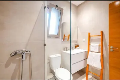a bathroom with a toilet and a sink at Appartement 2 chambres a PRESTIGIA piscine in Marrakech