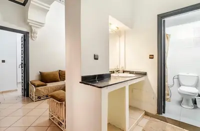 a bathroom with a toilet and a sink at Stay here in Marrakech