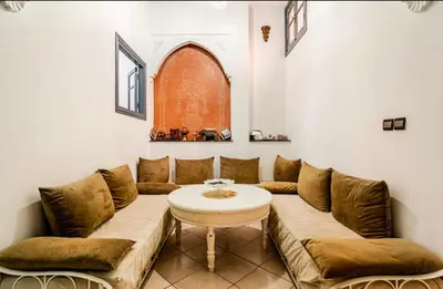 a living room with a couch and a table at Stay here in Marrakech