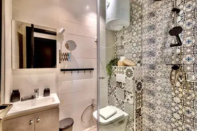 a bathroom with a toilet and a sink and a shower at Appartement Standing Marrakech Caricia in Marrakech