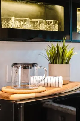a tea pot on a cutting board on a kitchen counter at Appartement Standing Marrakech Caricia in Marrakech