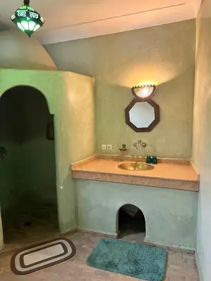 a bathroom with a sink and a mirror at RIAD Dar Aïlen Médina in Marrakech