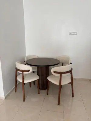 a table and two chairs and a table and chairs at Appartement Targa Marrakech in Marrakech