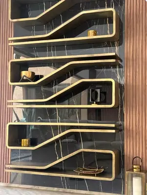 a closet with gold shelves with shoes on them at Villa Brin d'Olive Marrakech 6 chambres in Gzoula