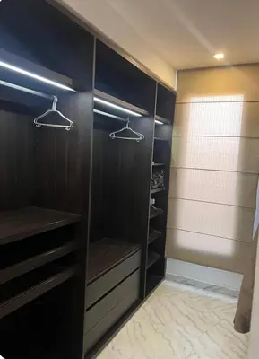 a walk in closet with black walls and shelves at Villa Brin d'Olive Marrakech 6 chambres in Gzoula