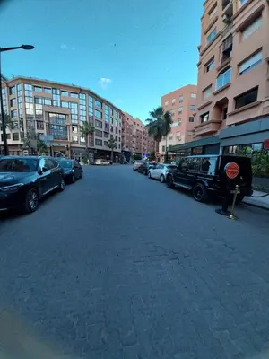 a street with cars parked on the side of a building at Studio Elégant Gueliz in Marrakech