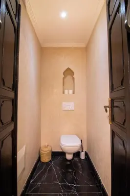 a bathroom with a toilet in a room at Riad Bloom in Marrakech