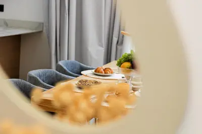 a table with a plate of food and a bowl of fruit at Villa de prestige avec piscine privée in Marrakech