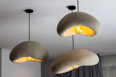 three lights are hanging from a ceiling at Villa de prestige avec piscine privée in Marrakech