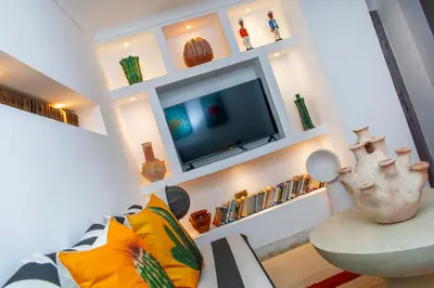 a living room with a tv and a couch at Riad Prive in Marrakech