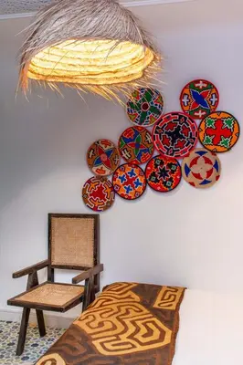 a wall with a bunch of plates on a wall at Riad Prive in Marrakech