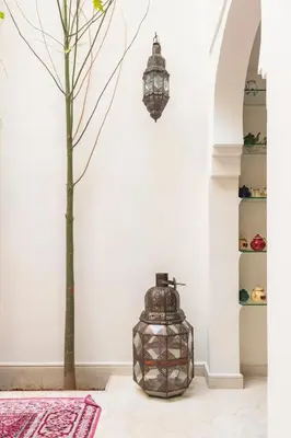 a room with a tree and a vase at Riad Koubba in Marrakech