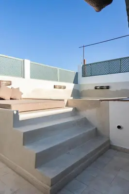 a set of concrete stairs in a house at Riad Koubba in Marrakech