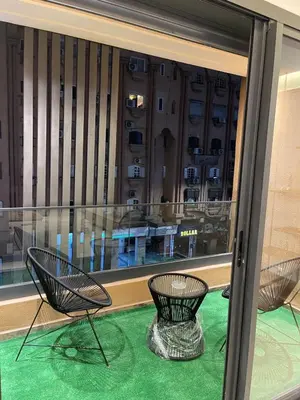 two chairs sitting in front of a window at City Luxe Studio in Marrakech