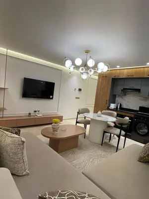 a living room with a couch and a table at City Luxe Studio in Marrakech