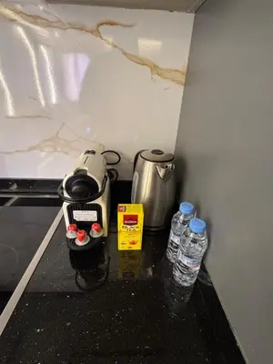 a kitchen counter with two bottles of water on it at City Luxe Studio in Marrakech