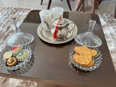 a table with two plates of food and two glasses at Appartement de luxe dans le centre de Marrakech in Marrakech
