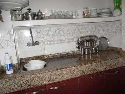 a kitchen sink with a faucet and a sink at Joli spacieux apparrement in Marrakech