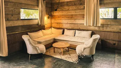 a living room with a couch and two chairs at The Source Hotel Music & Spa in Marrakech