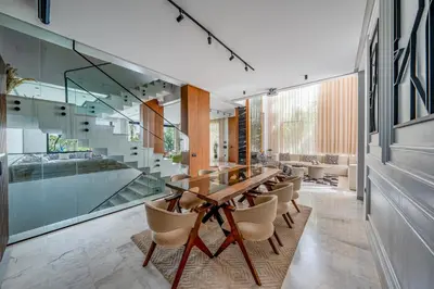 a dining room with a wooden table and chairs at Villa Kniza Luxury Stay, Courtyard, Pool and View in Marrakech