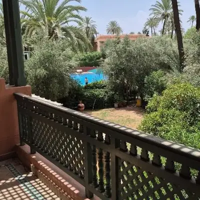Chic Palm Grove Apartment Pool View