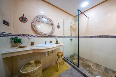 a bathroom with a sink and a shower at Appart 2Ch Centre Marrakech in Marrakech