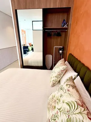 a bedroom with a bed and a mirror at Lovely condo Marrakech city center terrasse garage in Marrakech