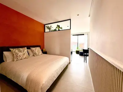 a bedroom with a large bed with a window at Lovely condo Marrakech city center terrasse garage in Marrakech